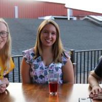 Three alumnae pose for a picture at Founders Brewing Co.